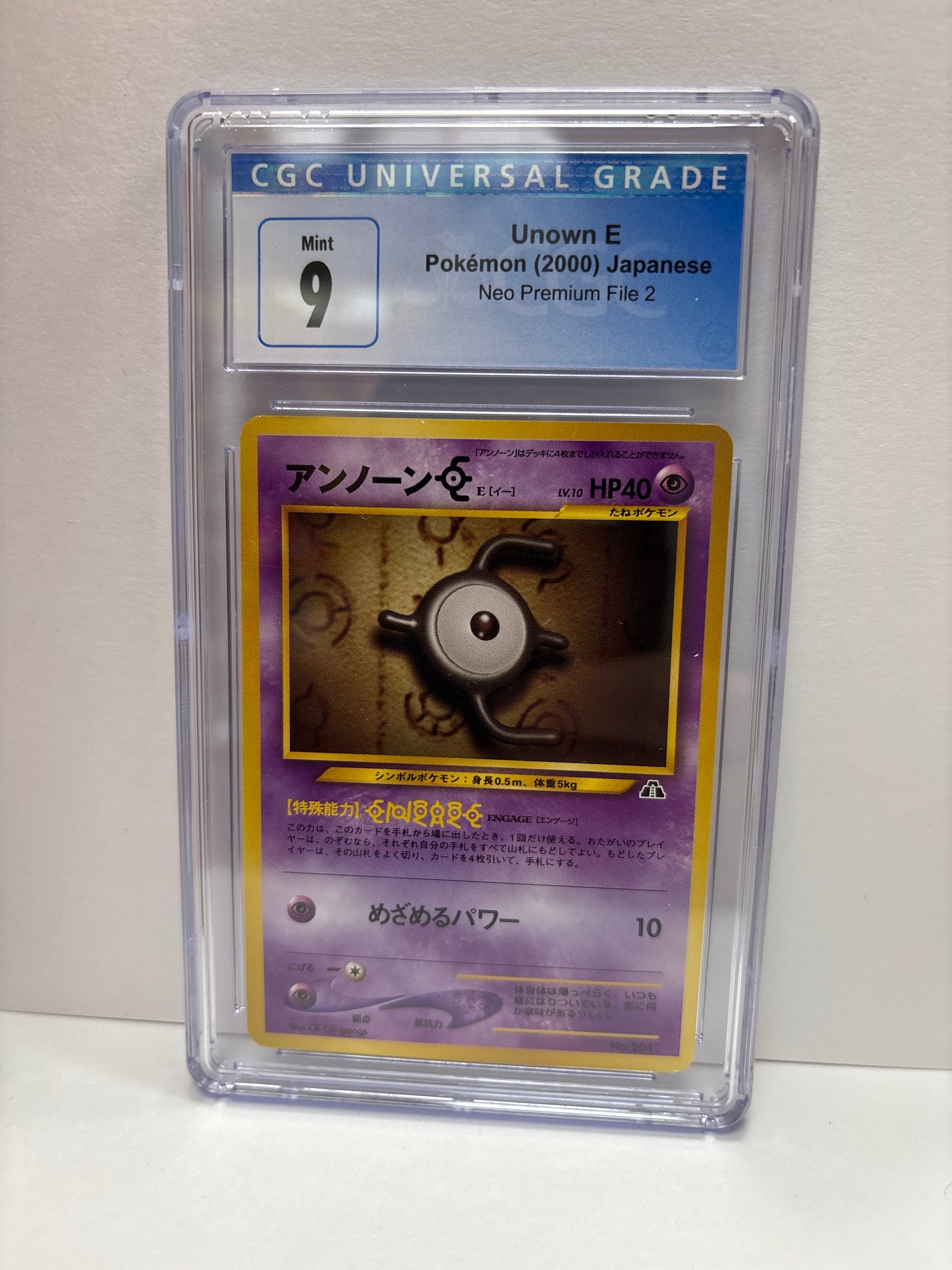 Pokemon Japanese Unown E #201 (2000) CGC 9 (Scratches on Slab)